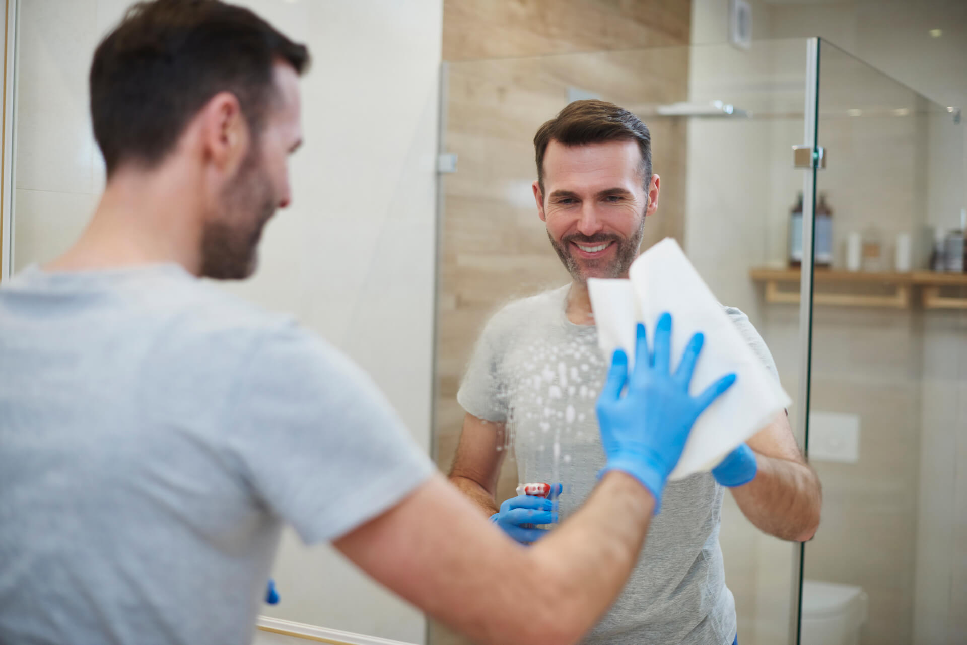 happy-man-cleaning-his-home-2021-08-26-20-15-41-utc.jpg